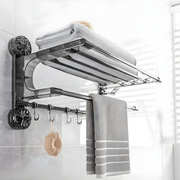 Double tier wall mounted towel rack in stainless steel by Best1, showcasing towels neatly organized on two shelves.