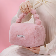 Best1 luxury fluffy faux fur cosmetic bag in soft pink, featuring a zip closure and spacious interior for makeup storage.