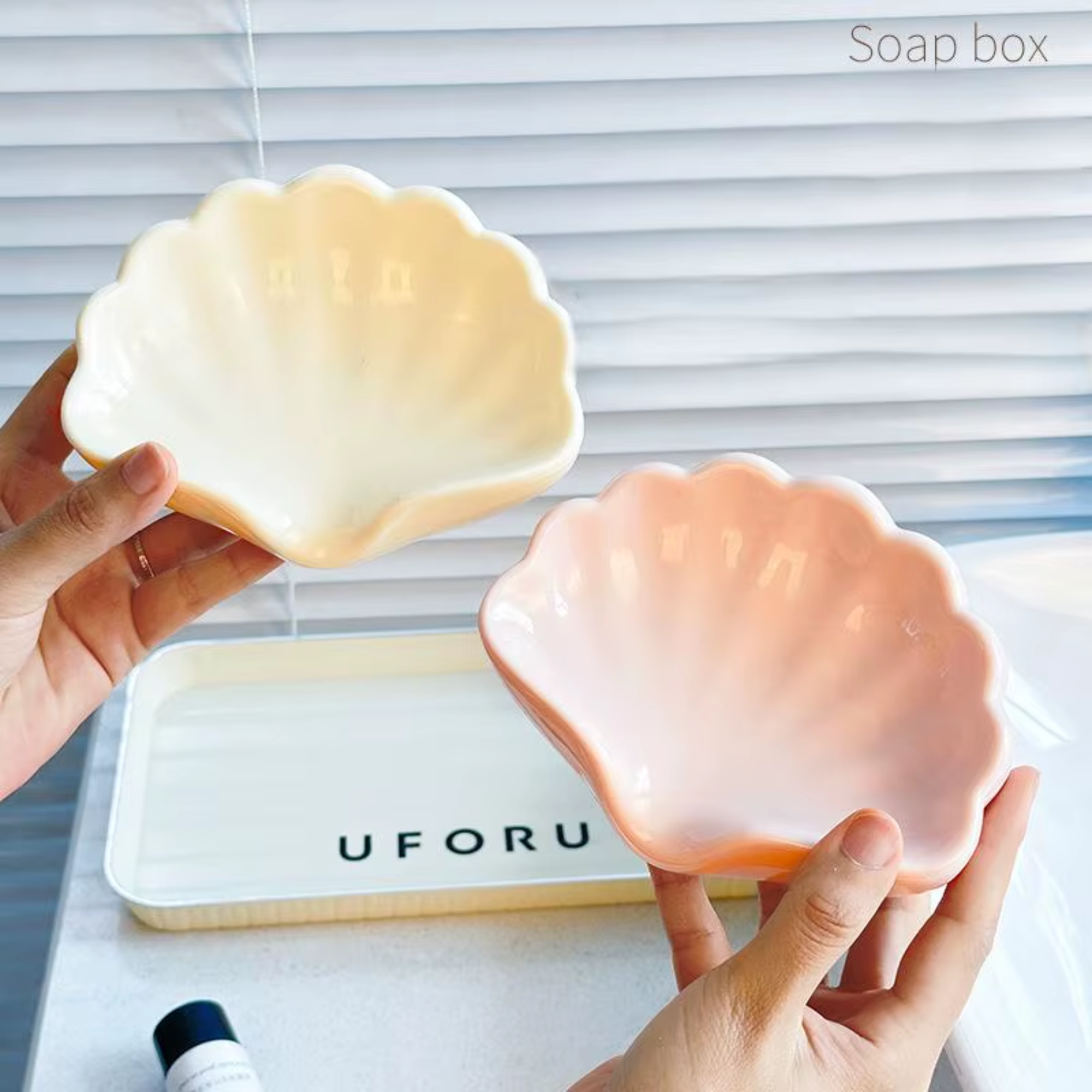 Best1 shell-shaped soap dish with drainage, elegantly designed for bathroom vanity use.