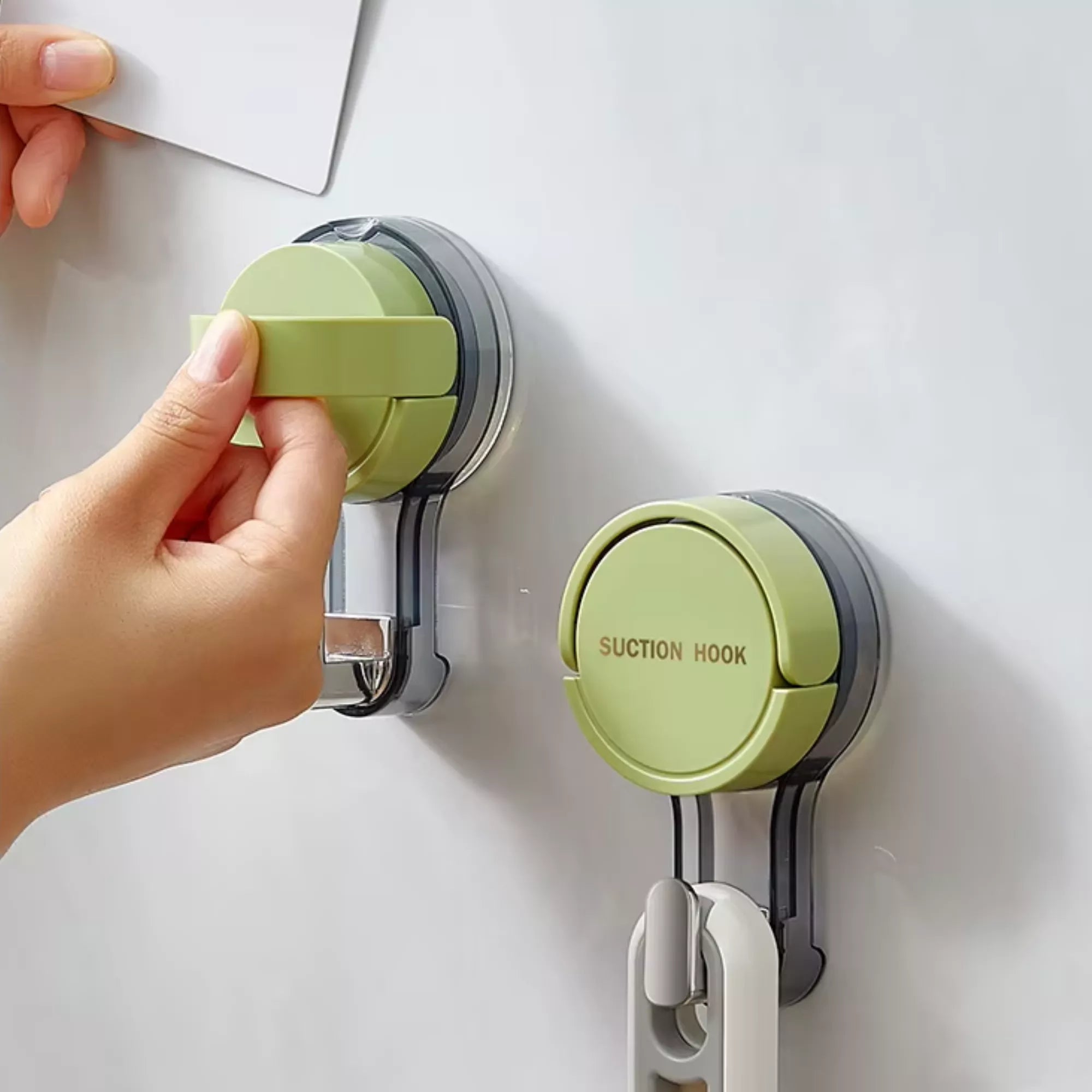 Best1 vacuum suction cup wall hook attached to a smooth surface, demonstrating its secure hold and practical design.
