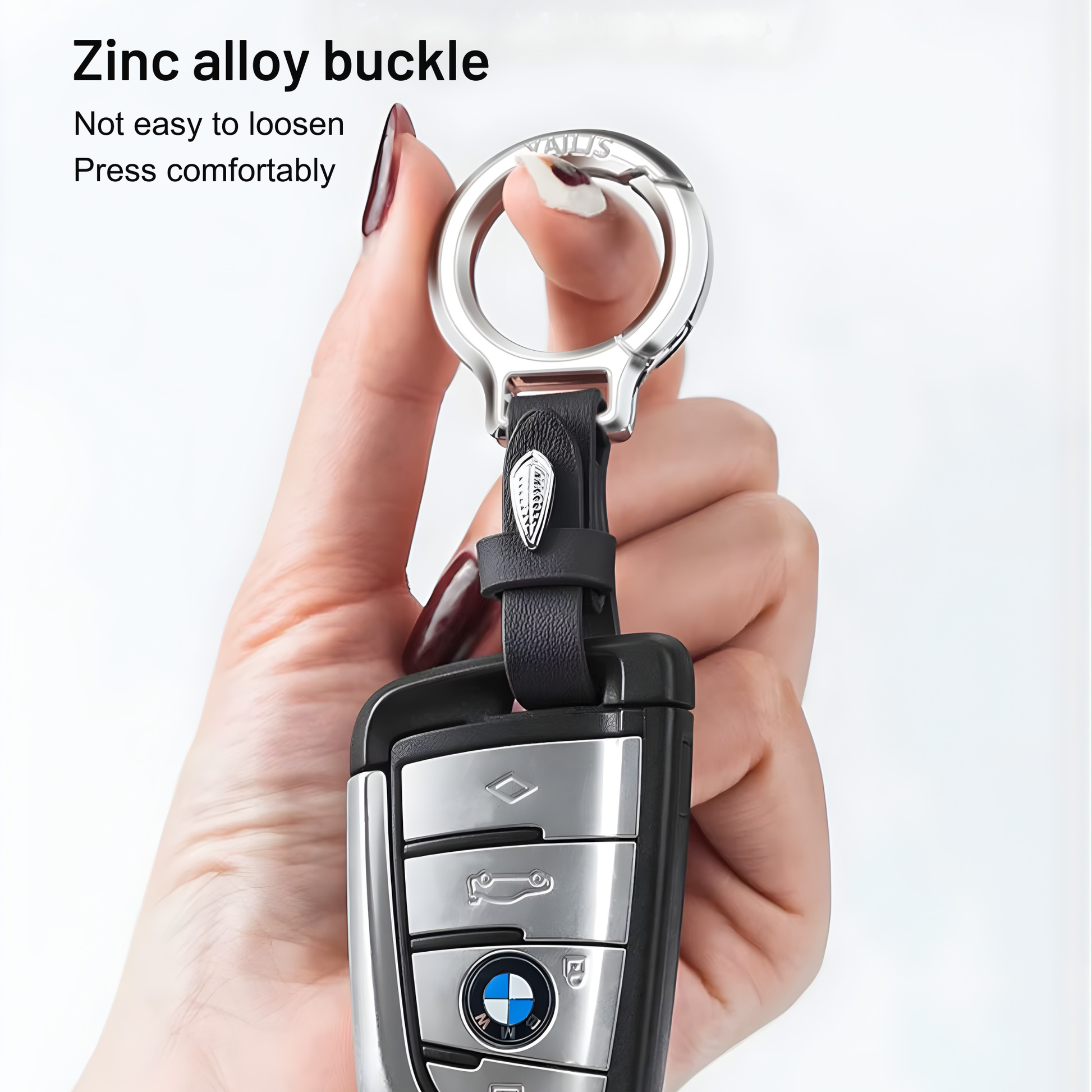 Best1 luxury black leather keychain for men with zinc alloy car key ring and premium clasp on a textured surface.